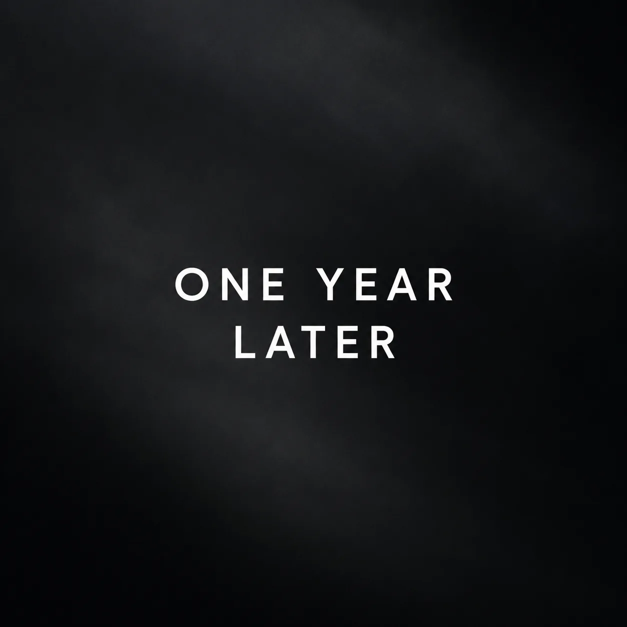 One Year Later set in white type on a dark textured background.